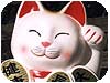 guesto è il Maneki neko il gatto portafortuna giapponese